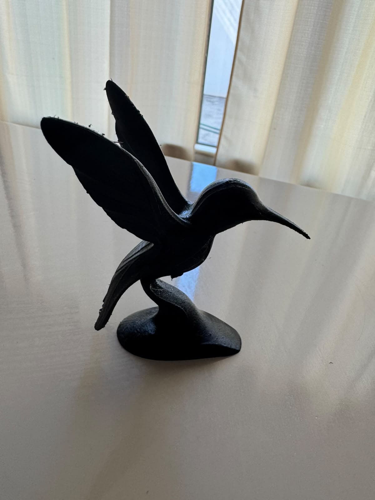 Escultura decorativa de beija-flor